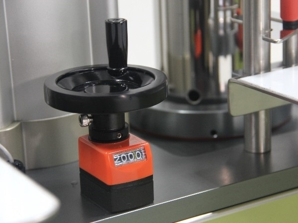 filling volume adjustment mechanism filling volume adjustment mechanism